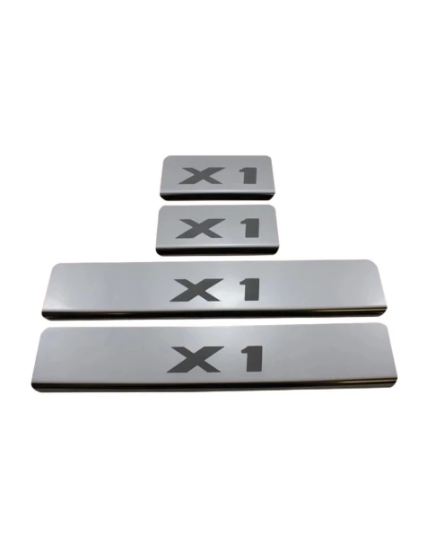 nakladki-progowe-BMW-X1-E84-stal-nierdzewna-polysk-grawer-lustro-chrom.jpg